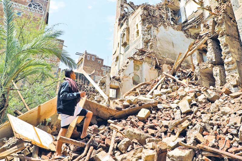 A man inspects a collapsed UNESCO-listed building
