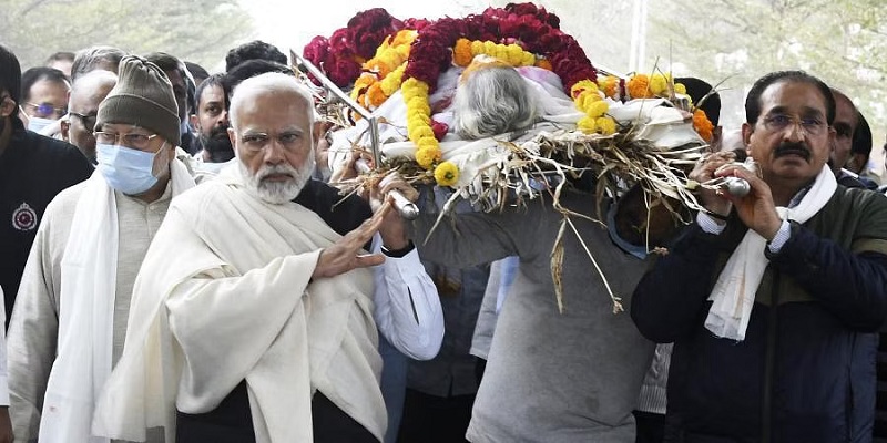 Indian Prime Minister Narendra Modi carries the mortal remains of his mother Heeraben Modi, who passed away at the age of 100, in Gandhinagar, on December 30, 2022. (Photo: PTI)