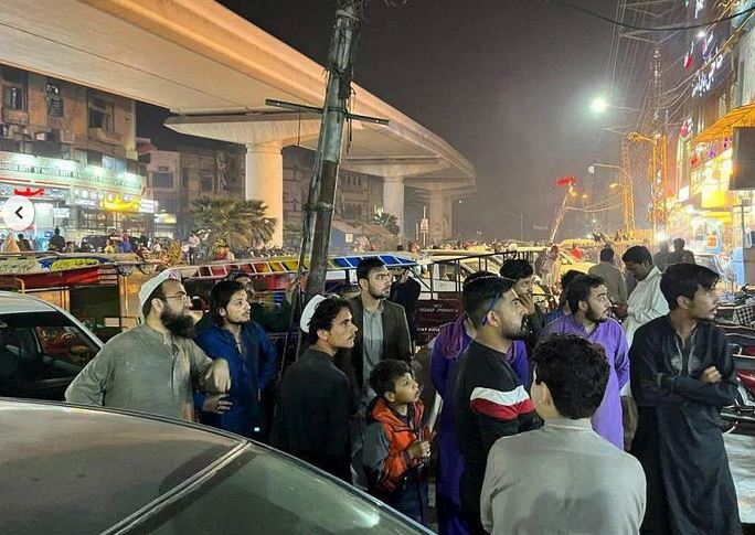 People leaving a restaurant after a tremor was felt in Lahore, Pakistan, on March 21.